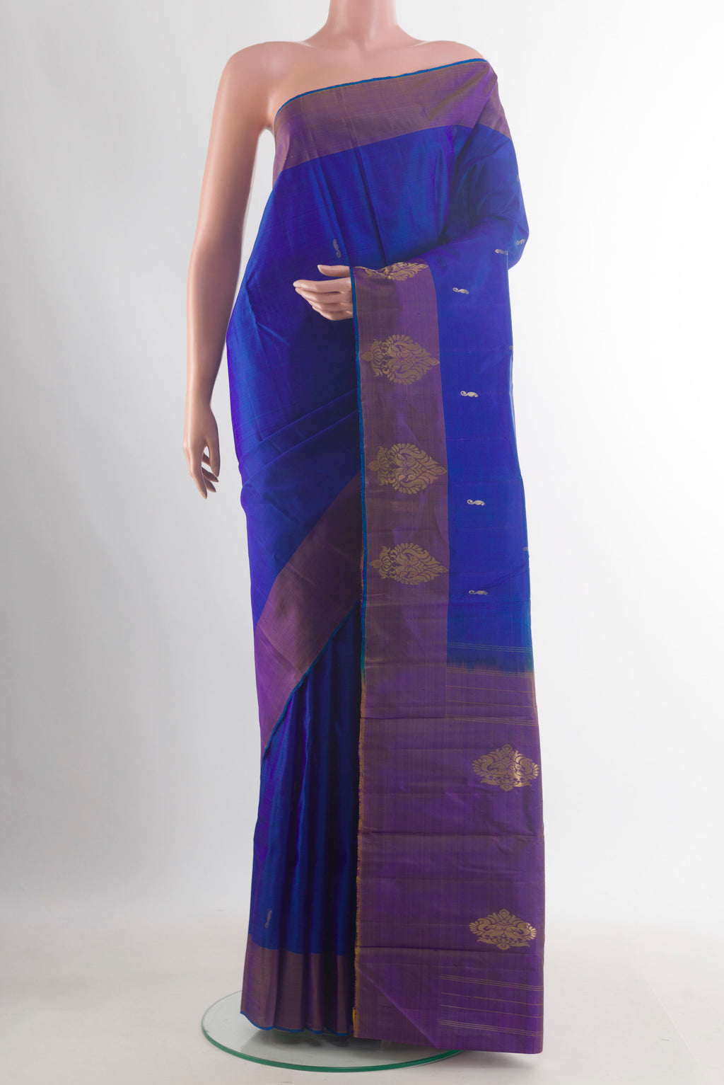 Pure Silk Royal Blue Kanchipuram Saree with Zari Butta on the body and Zari Border.  displayed on a mannequin