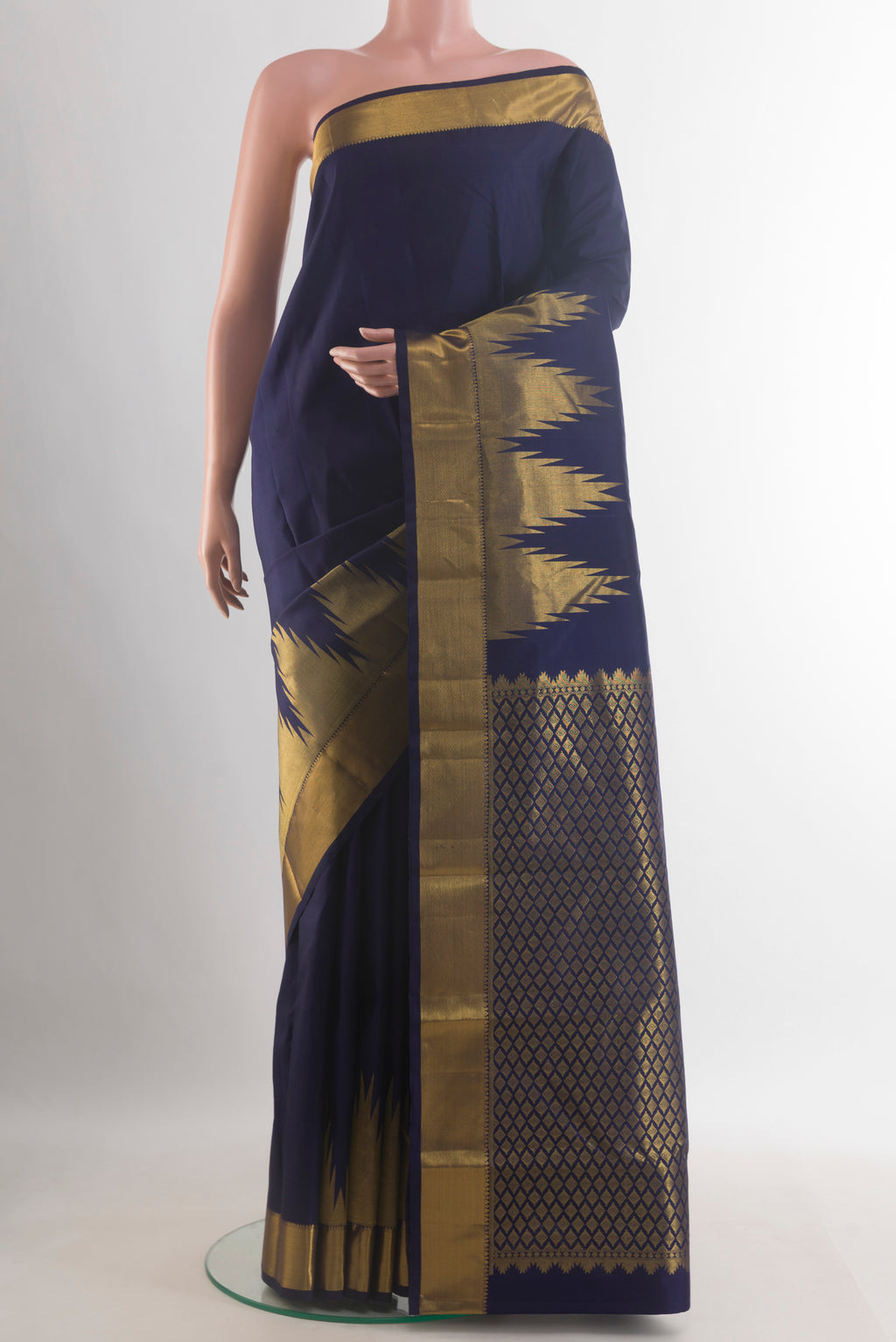 Pure Silk Navy Blue Kanchipuram Saree with Plain Body and Temple Border.  displayed on a mannequin