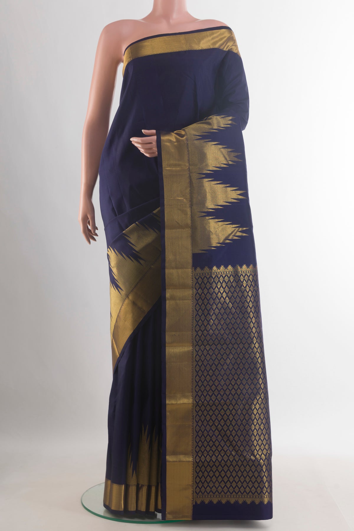 Pure Silk Navy Blue Kanchipuram Saree with Plain Body and Temple Border.  displayed on a mannequin