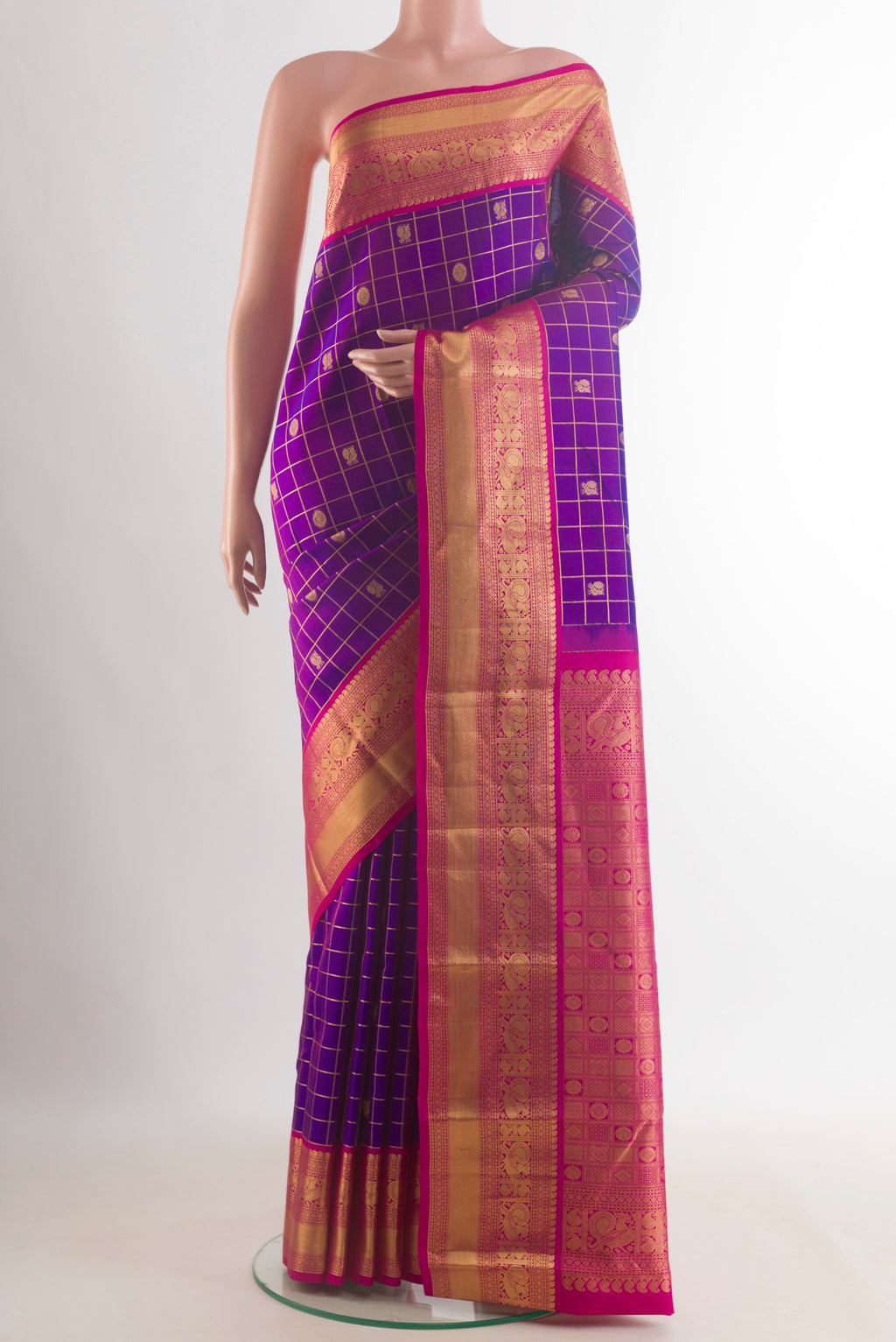 Pure Silk Purple Kanchipuram Saree with Checked design on the body and Zari Border.  displayed on a mannequin
