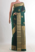 Pure Silk Bottle Green Kanchipuram Saree with Zari Butta on the body and Zari Border.  displayed on a mannequin