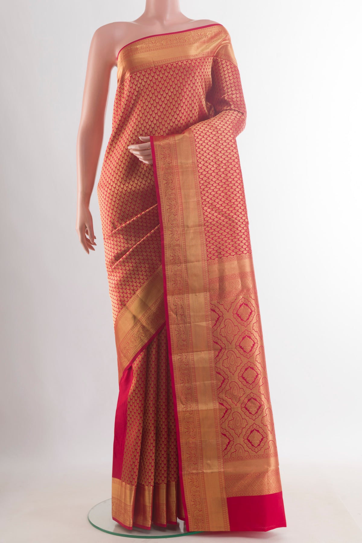 Pure Silk Red Kanchipuram Saree with Zari Brocade on the body and Zari Border.  displayed on a mannequin