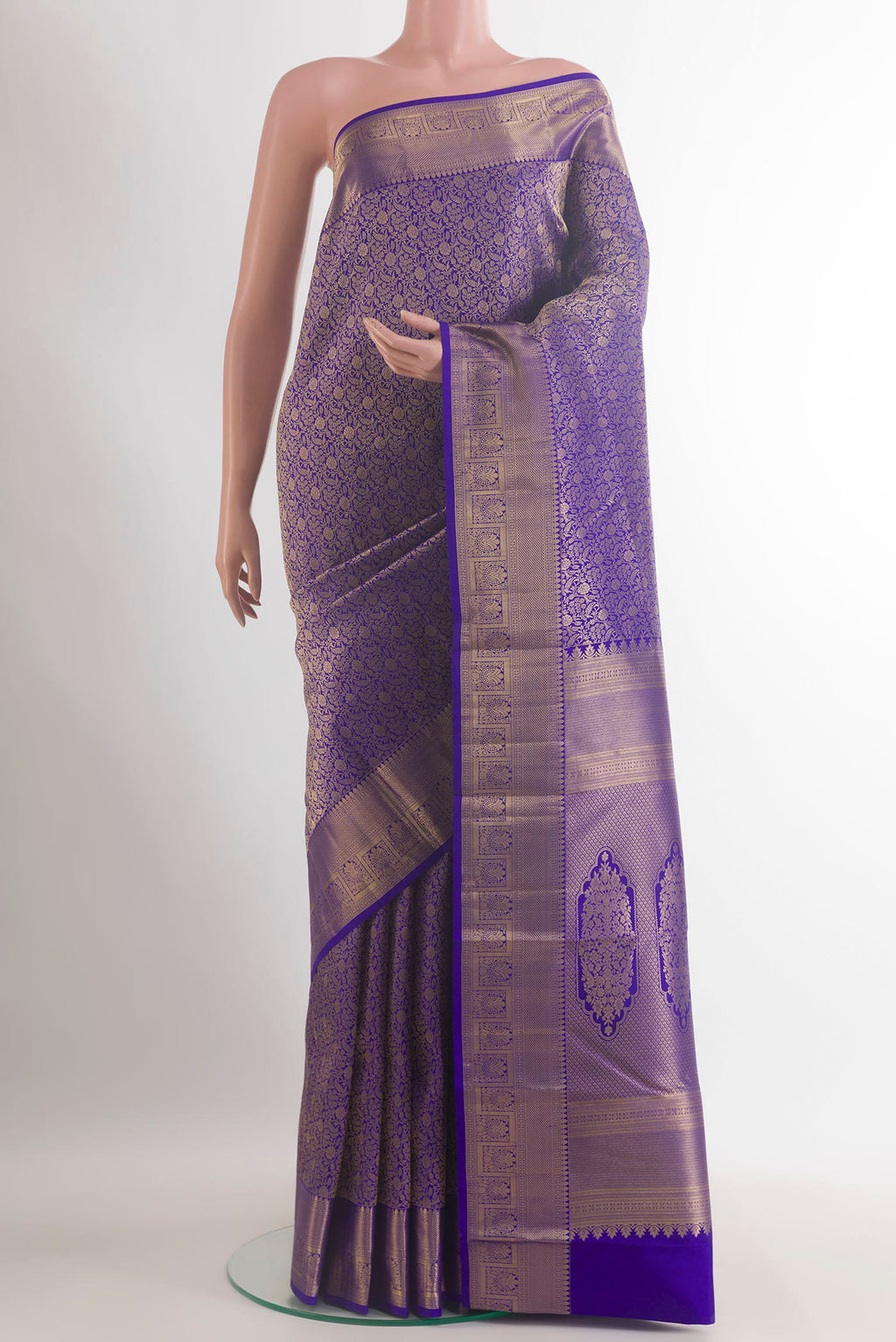 Pure Silk Royal Blue Kanchipuram Saree with Zari Brocade on the body and Zari Border.  displayed on a mannequin