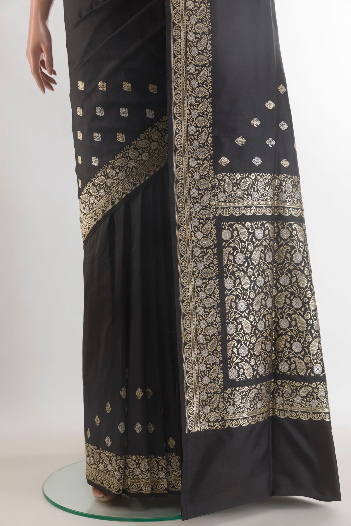 Pleats and pallu of Pure Silk Black Banarasi Saree with Plain Body and Zari Border. 