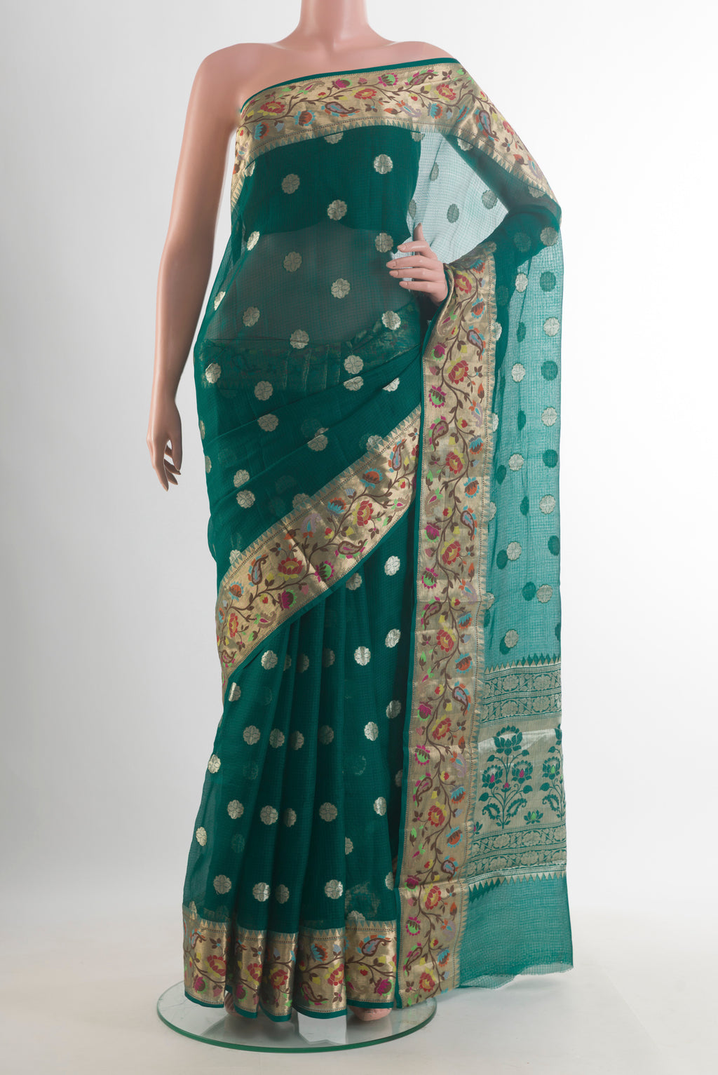 Pure Silk Green Banarasi Kota Saree with Zari Butta on the body and Zari Border.  displayed on a mannequin