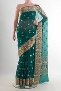 Pure Silk Green Banarasi Kota Saree with Zari Butta on the body and Zari Border.  displayed on a mannequin