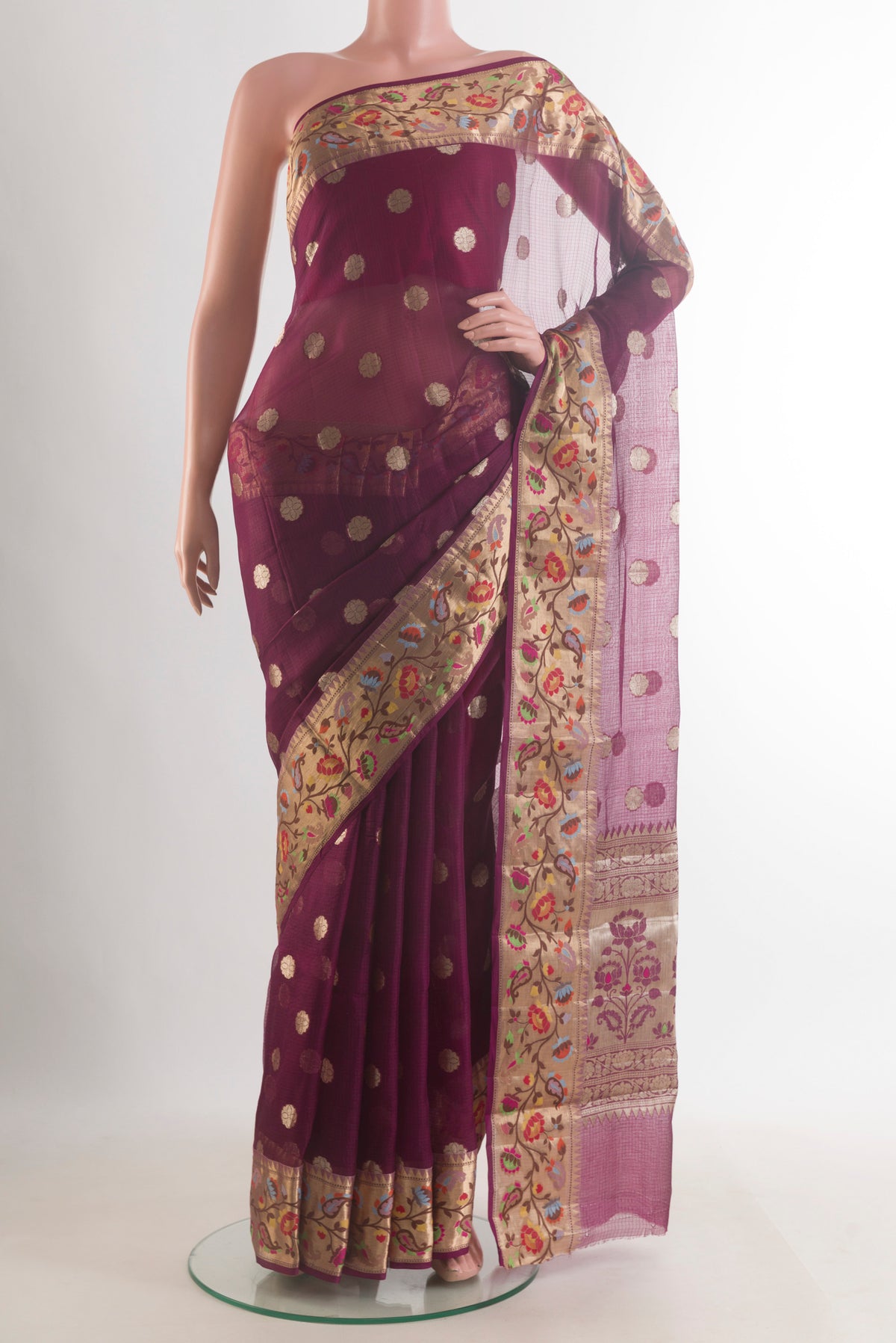 Pure Silk Burgundy Banarasi Kora Saree with Zari Butta on the body and Zari Border.  displayed on a mannequin