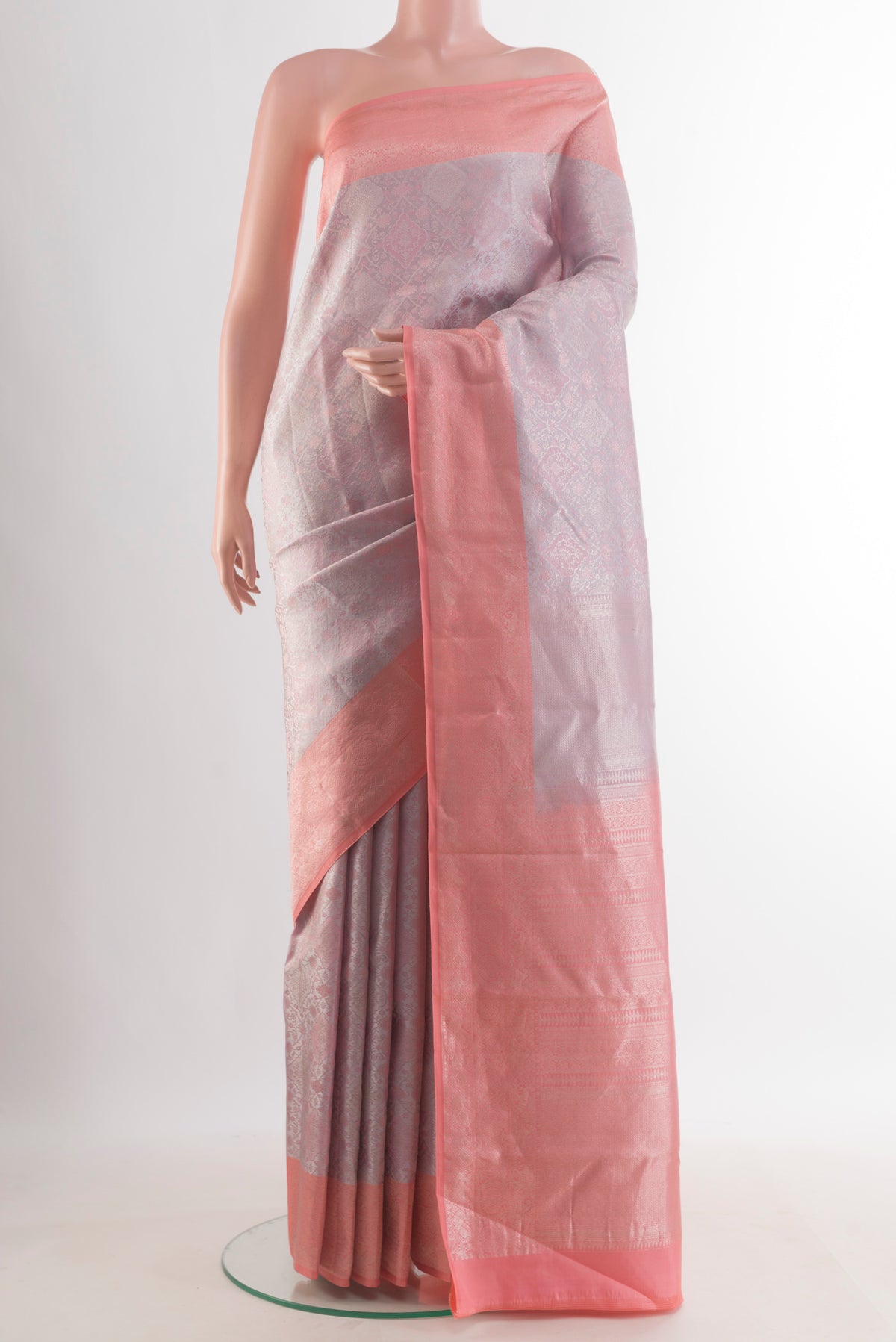 Pure Silk Lavender Kanchipuram Saree with Zari Brocade on the body and Zari Border.  displayed on a mannequin
