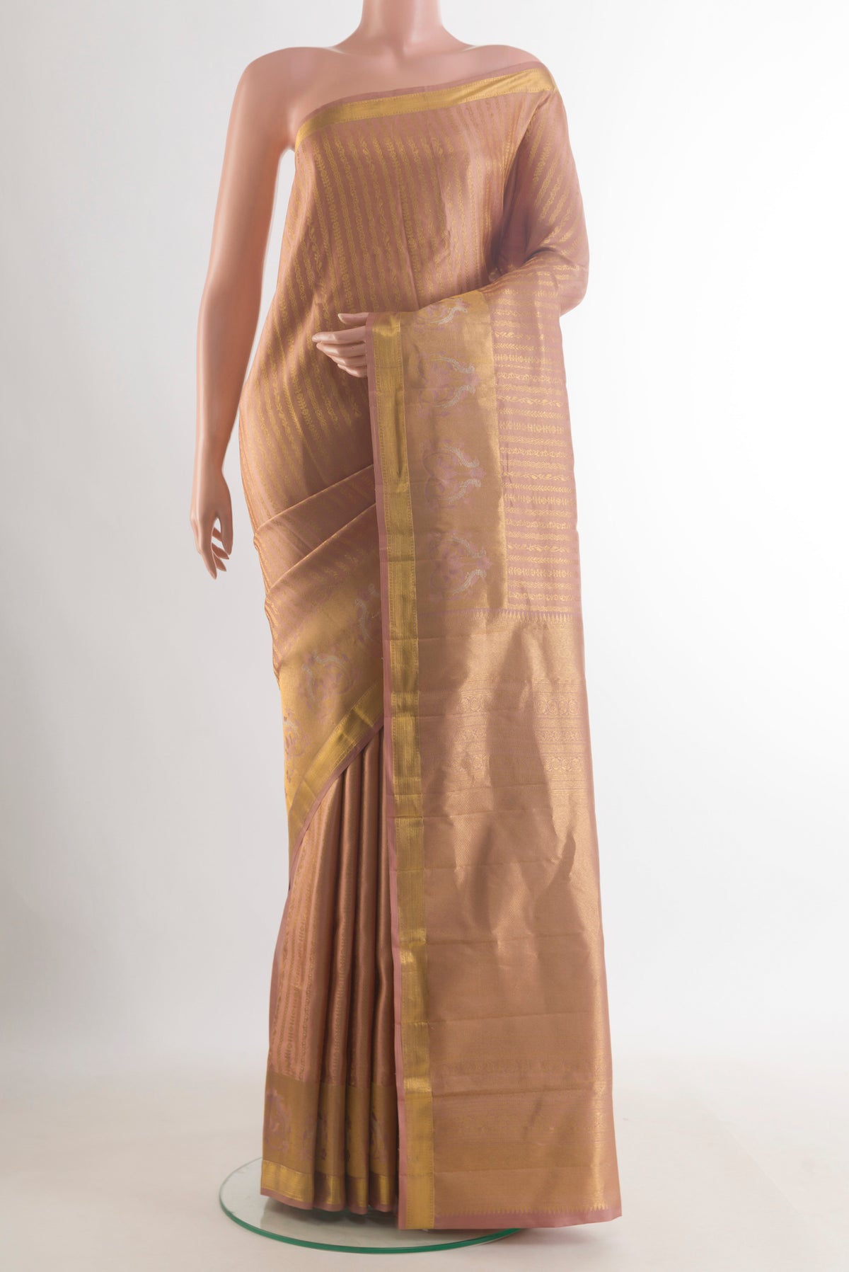 Pure Silk Golden Kanchipuram Saree with Stripes on the body and Zari Border.  displayed on a mannequin
