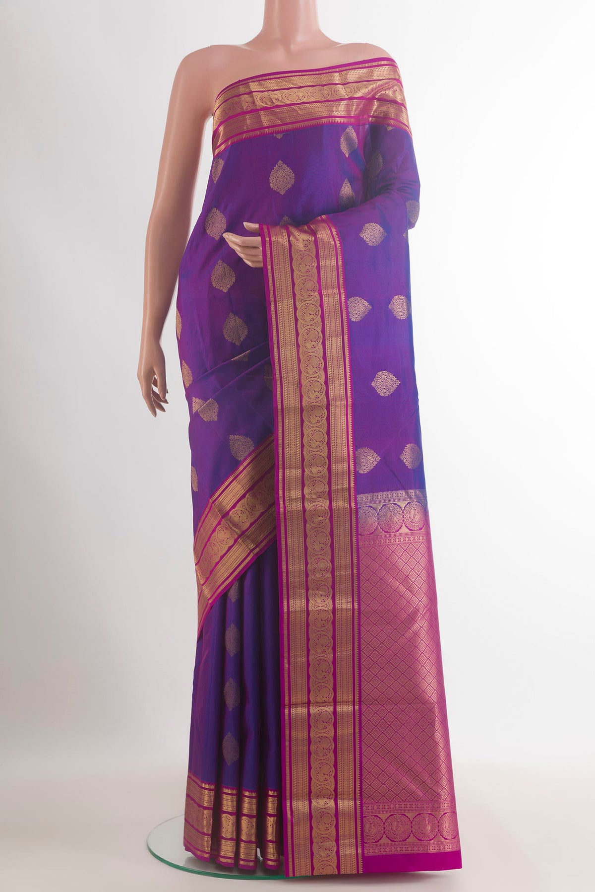Pure Silk Purple Kanjivaram Saree with Jacquard With Zari Butta on the body and Zari Border.  displayed on a mannequin