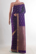 Pure Silk Violet Kanchipuram Saree with Zari Butta on the body and Zari Border.  displayed on a mannequin