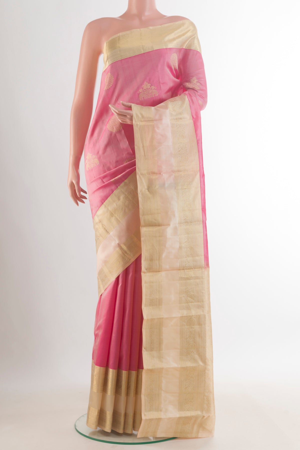 Pure Silk Pink Kanjivaram Saree with Zari Butta on the body and Zari Border.  displayed on a mannequin