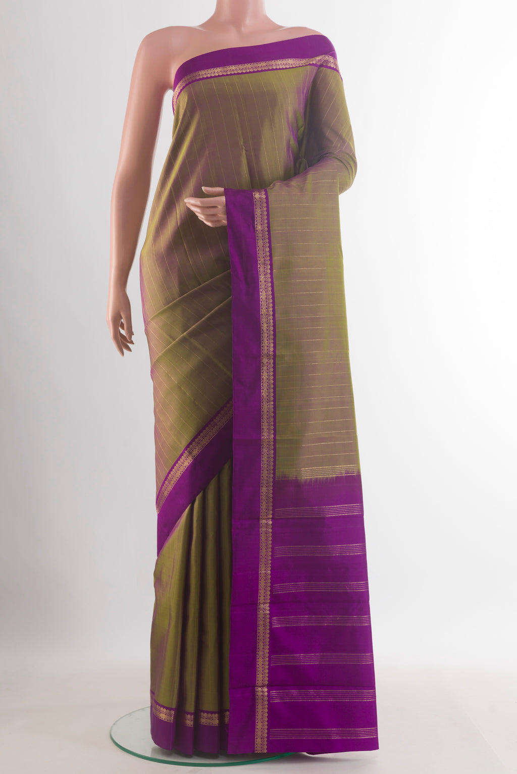 Pure Silk Mehandi Green Kanjivaram Saree with Checked design on the body and Zari Border.  displayed on a mannequin