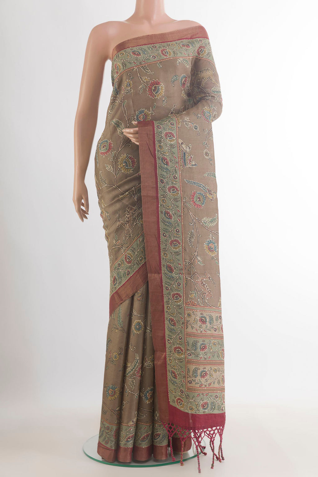 Beige Tussar Saree with Embroidered on the body and Embroidered Border.  displayed on a mannequin