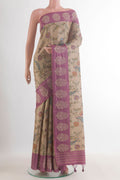 Beige Tussar Saree with Printed design on the body and Embroidered Border.  displayed on a mannequin