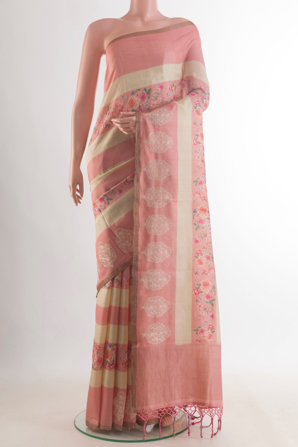 Pink Tussar Saree with Stripes on the body and Embroidered Border.  displayed on a mannequin
