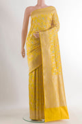 Pure Silk Yellow Banarasi Saree with Zari Brocade on the body and Zari Border.  displayed on a mannequin