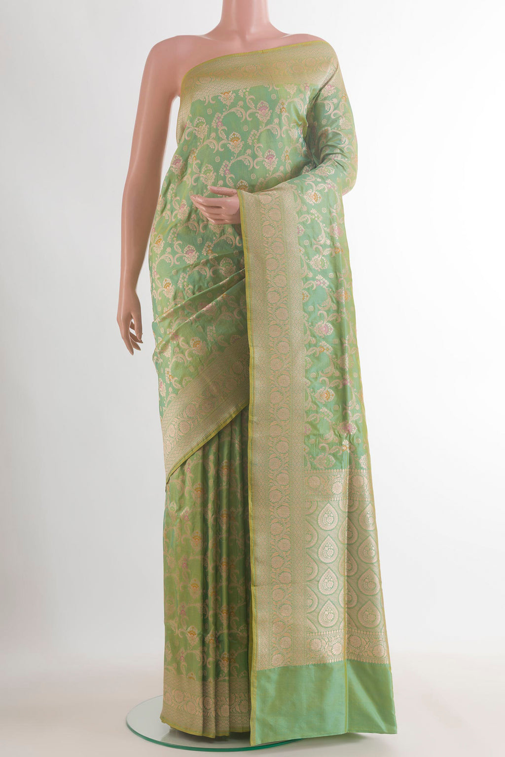 Pure Silk Green Banarasi Saree with Zari Brocade on the body and Zari Border.  displayed on a mannequin