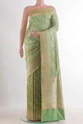 Pure Silk Green Banarasi Saree with Zari Brocade on the body and Zari Border.  displayed on a mannequin