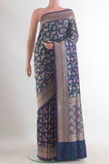 Pure Silk Peacock Blue Dual Tone Banarasi Saree with Zari Butta on the body and Zari Border.  displayed on a mannequin