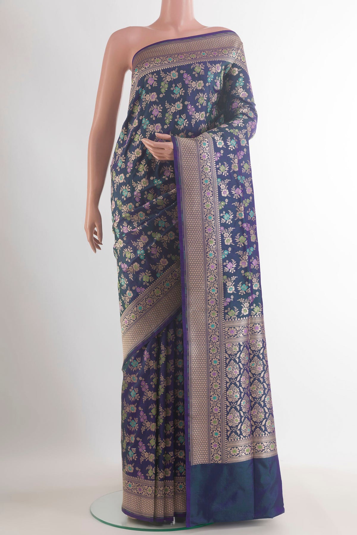 Pure Silk Peacock Blue Dual Tone Banarasi Saree with Zari Butta on the body and Zari Border.  displayed on a mannequin