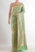 Pure Silk Green Banarasi Saree with Zari Butta on the body and Zari Border.  displayed on a mannequin