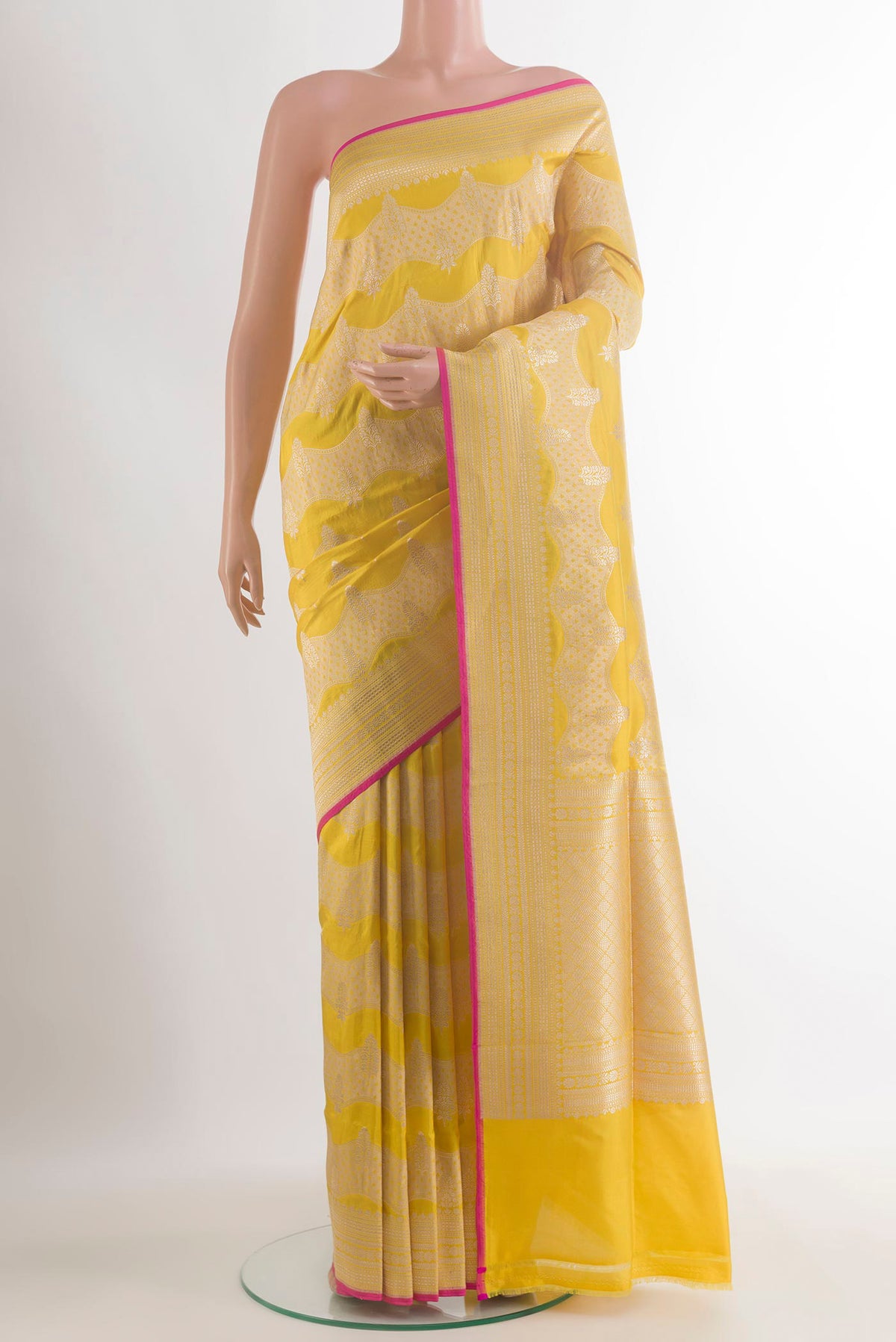 Pure Silk Yellow Banarasi Saree with Zari Butta on the body and Zari Border.  displayed on a mannequin