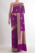 Pure Silk Purple Banarasi Saree with Zari Butta on the body and Zari Border.  displayed on a mannequin