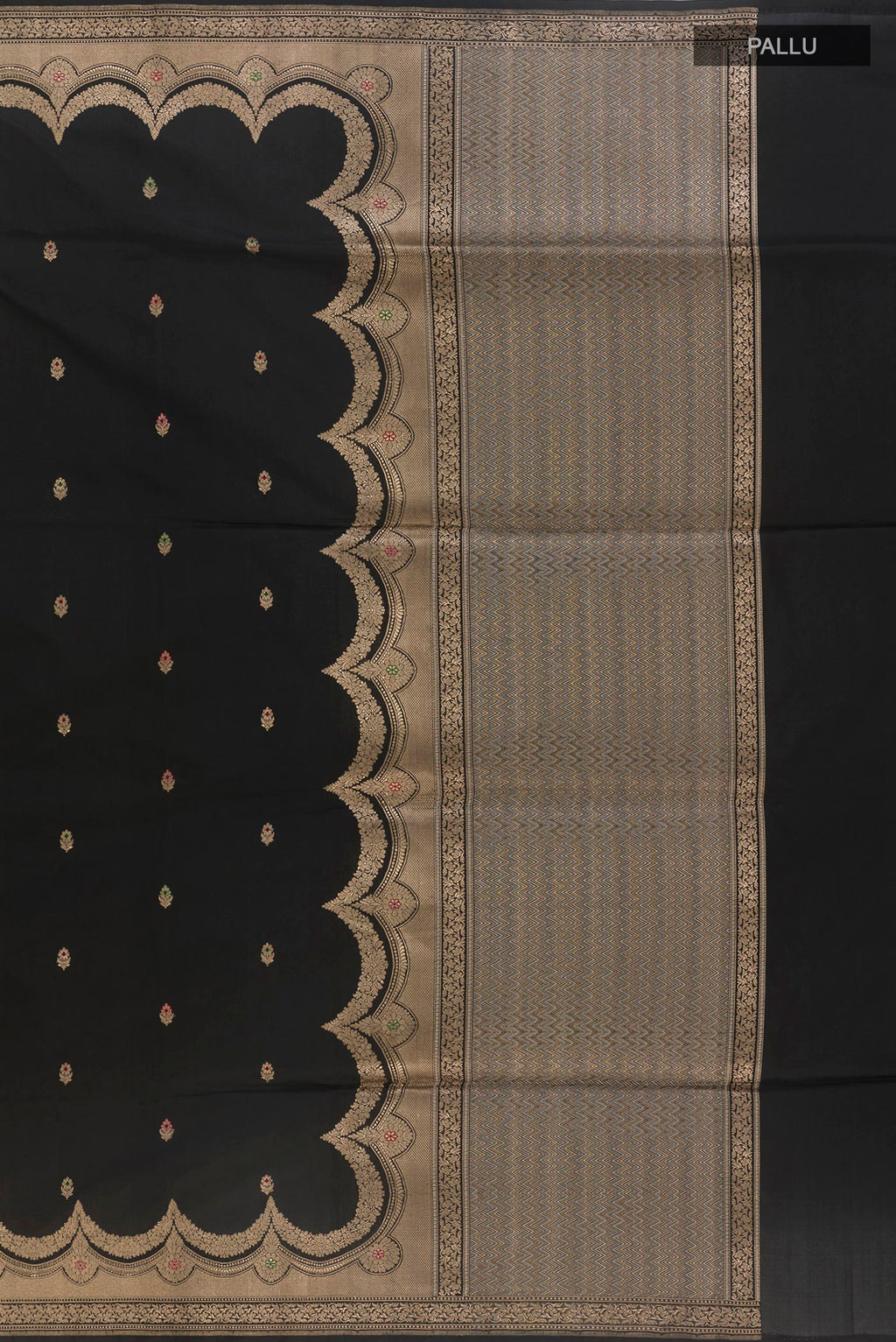 Close up image of the pallu of Pure Silk Black Banarasi Saree with Zari Butta on the body and Zari Border. 