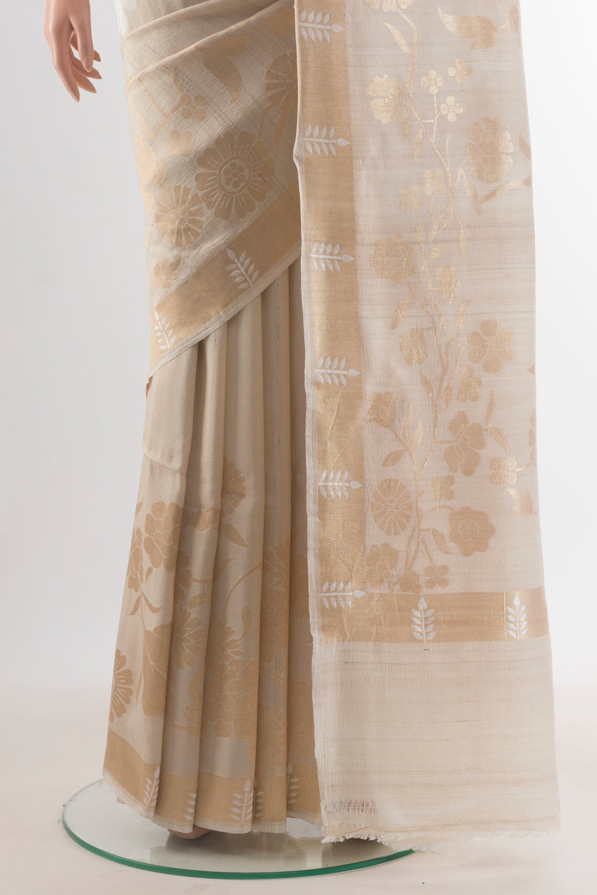Pleats and pallu of Off White Tussar Saree with Zari Butta on the body and Zari Border. 