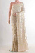 Off White Banarasi Tussar Saree with Stripes on the body and Zari Border.  displayed on a mannequin