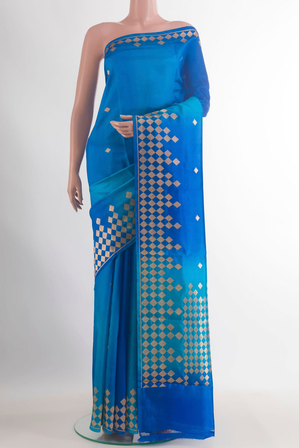 Pure Silk Royal Blue Banarasi Katan Saree with Zari Butta on the body and Zari Border.  displayed on a mannequin