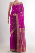 Pure Silk Magenta Soft Saree with Zari Butta on the body and Zari Border.  displayed on a mannequin
