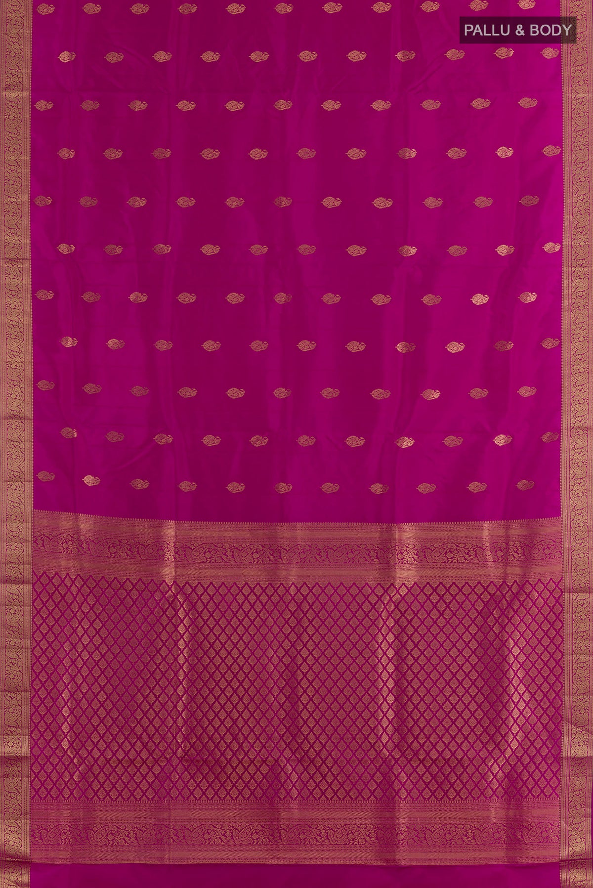 Flat view of Pure Silk Magenta Soft Saree with Zari Butta on the body and Zari Border. 
