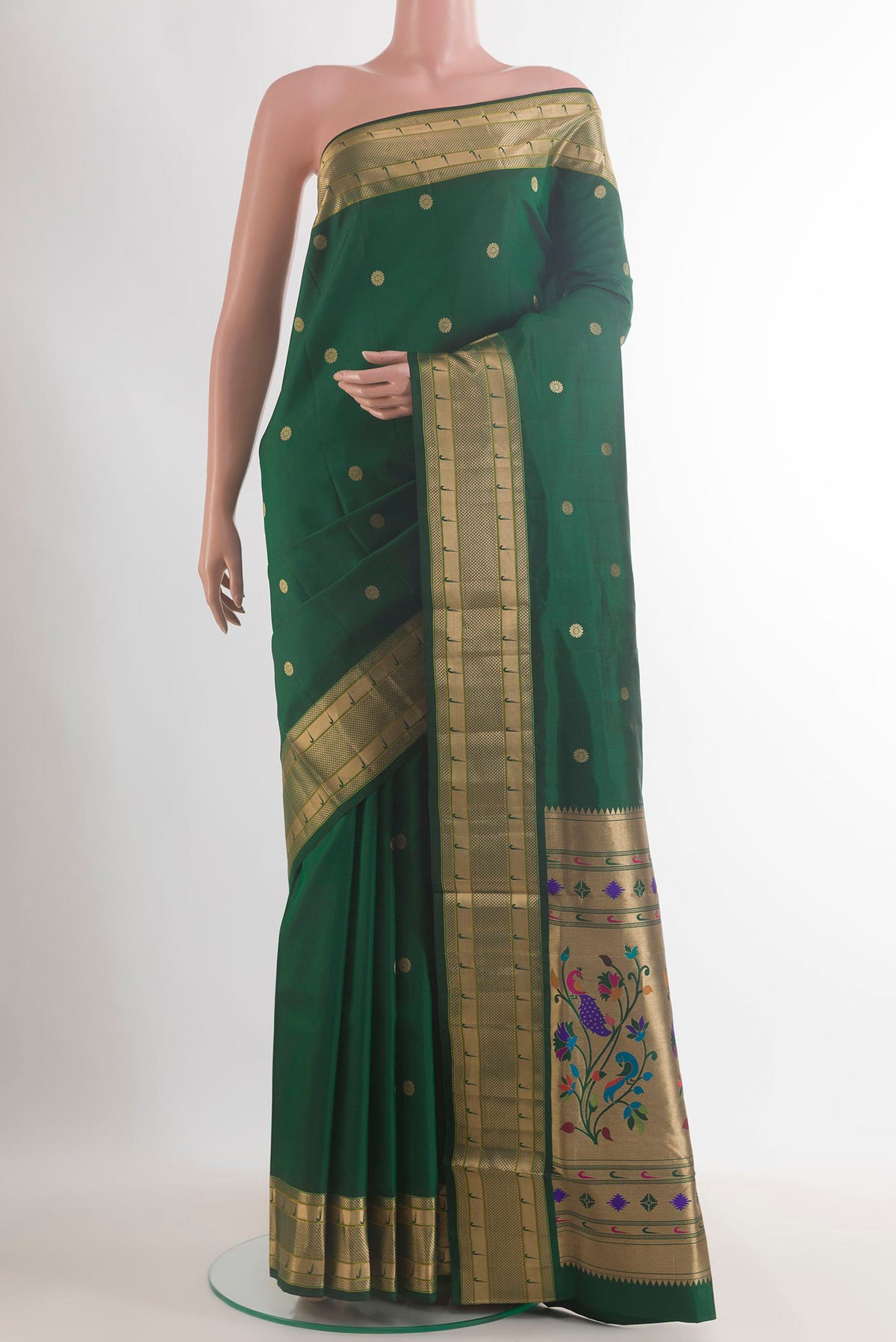 Pure Silk Bottle Green Soft Saree with Zari Butta on the body and Paithani Border.  displayed on a mannequin