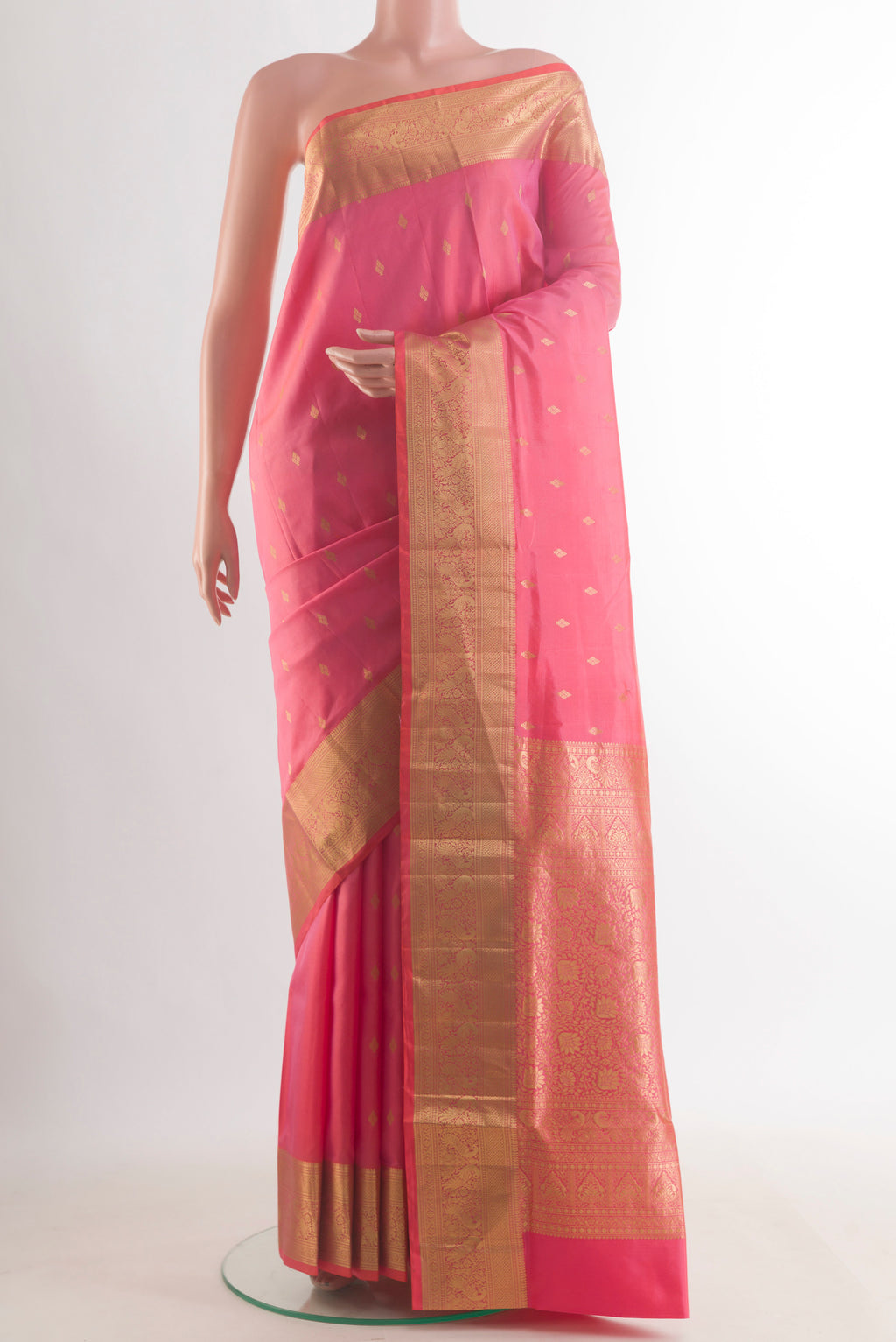 Pure Silk Pink Soft Saree with Zari Butta on the body and Zari Border.  displayed on a mannequin