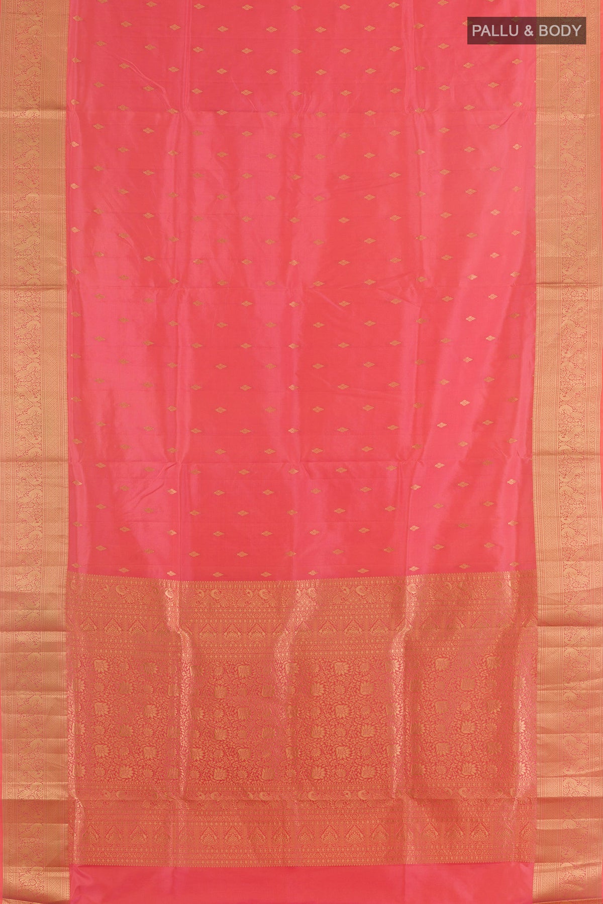 Flat view of Pure Silk Pink Soft Saree with Zari Butta on the body and Zari Border. 