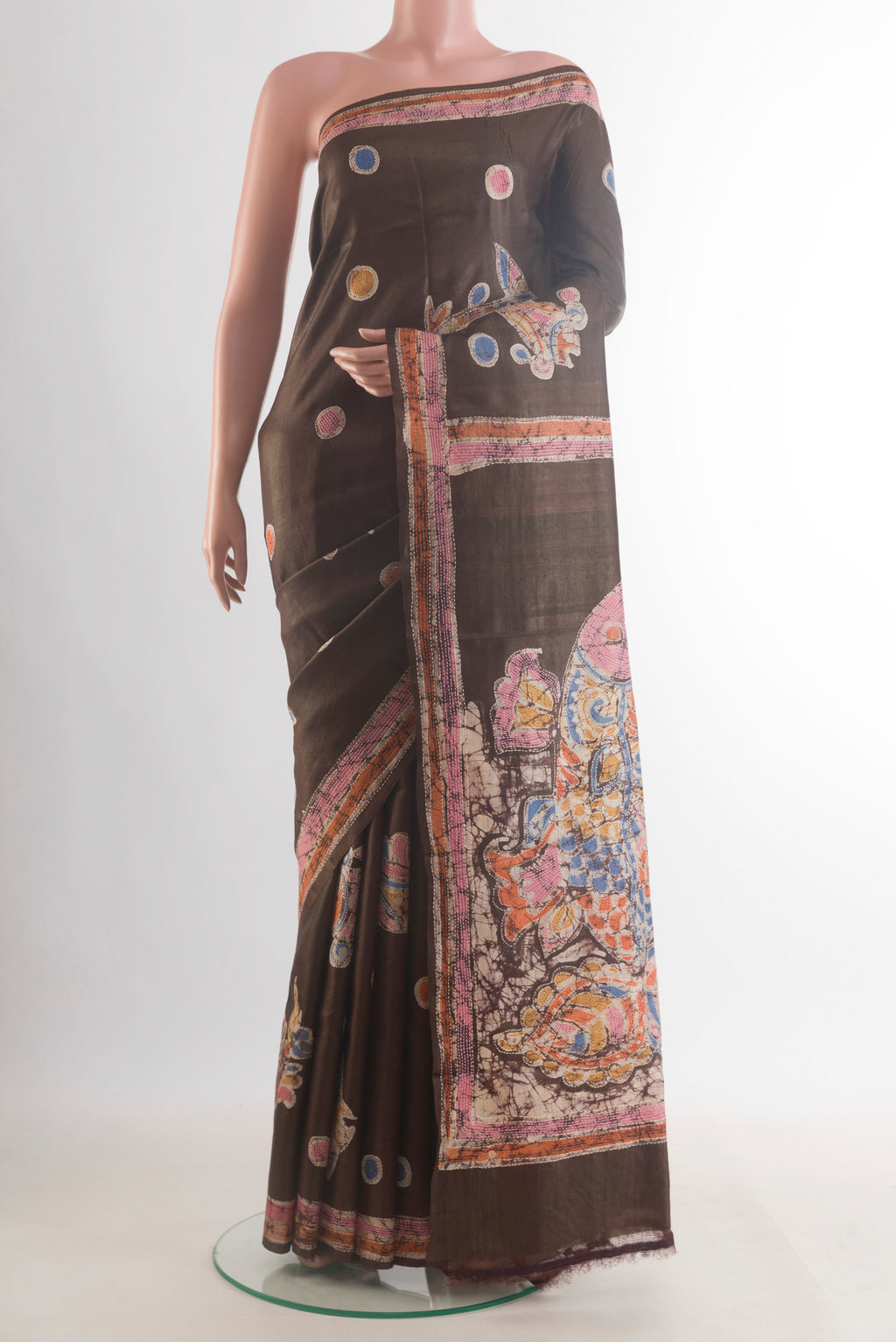 Brown Tussar Saree with Kantha Work on the body and Embroidered Border.  displayed on a mannequin