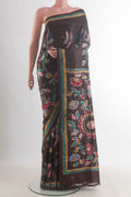 Brown Tussar Saree with Kantha Work on the body and Embroidered Border.  displayed on a mannequin