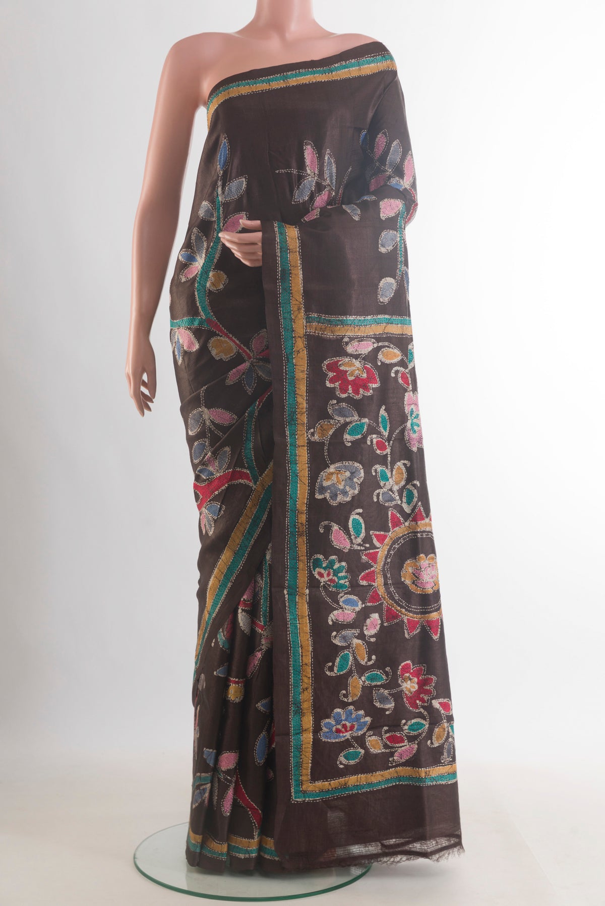 Brown Tussar Saree with Kantha Work on the body and Embroidered Border.  displayed on a mannequin
