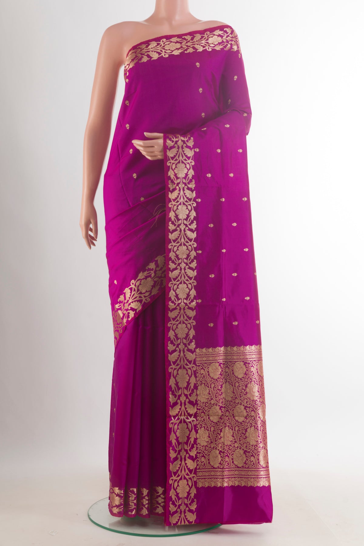Pure Silk Magenta Banarasi Katan Saree with Zari Butta on the body and Zari Border.  displayed on a mannequin