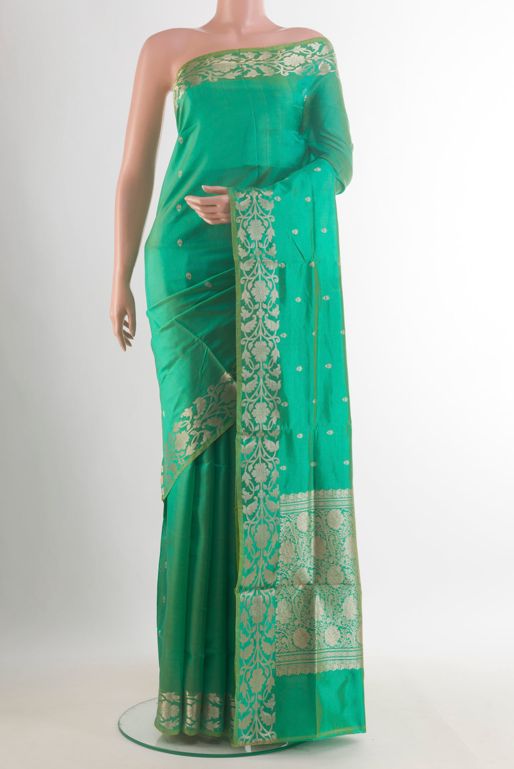 Pure Silk Green Banarasi Katan Saree with Zari Butta on the body and Zari Border.  displayed on a mannequin