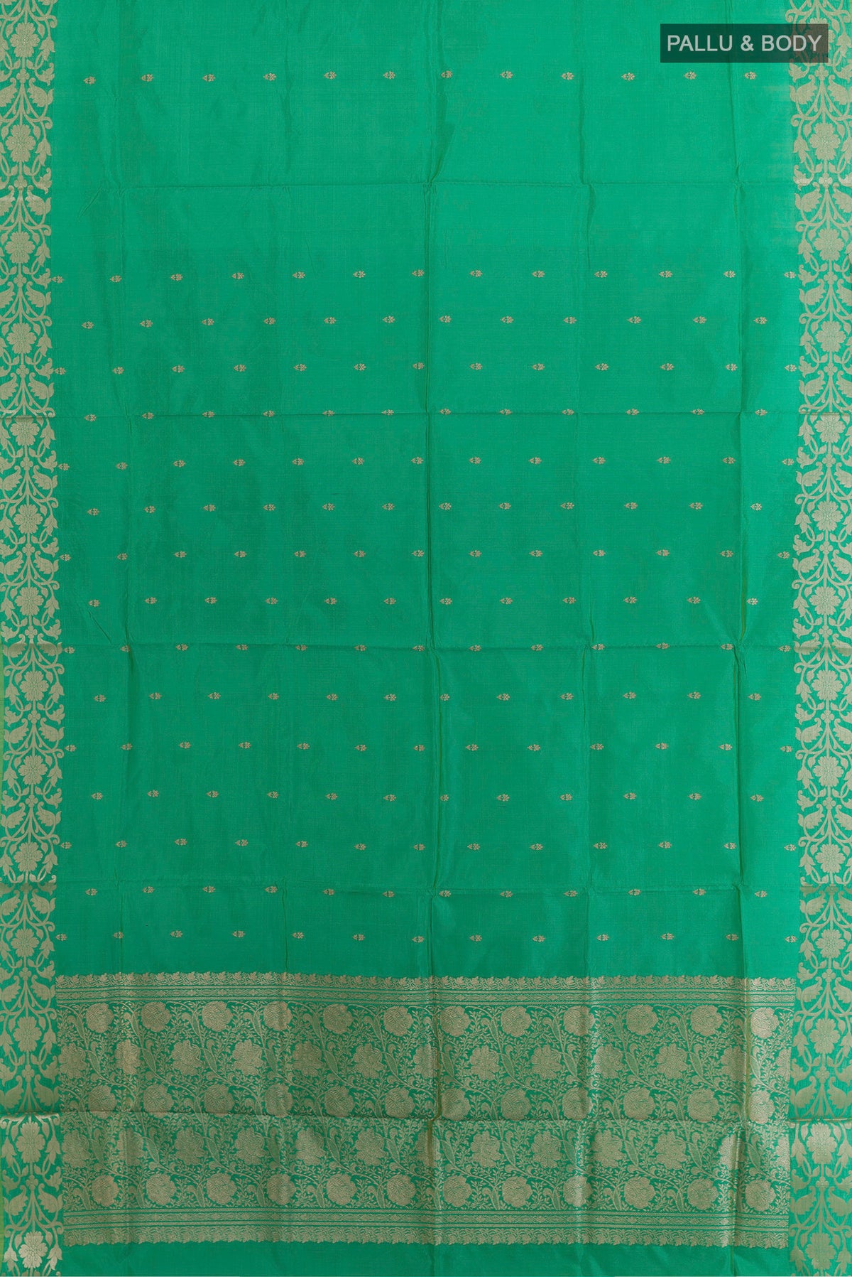 Flat view of Pure Silk Green Banarasi Katan Saree with Zari Butta on the body and Zari Border. 