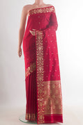 Pure Silk Red Banarasi Katan Saree with Zari Butta on the body and Zari Border.  displayed on a mannequin