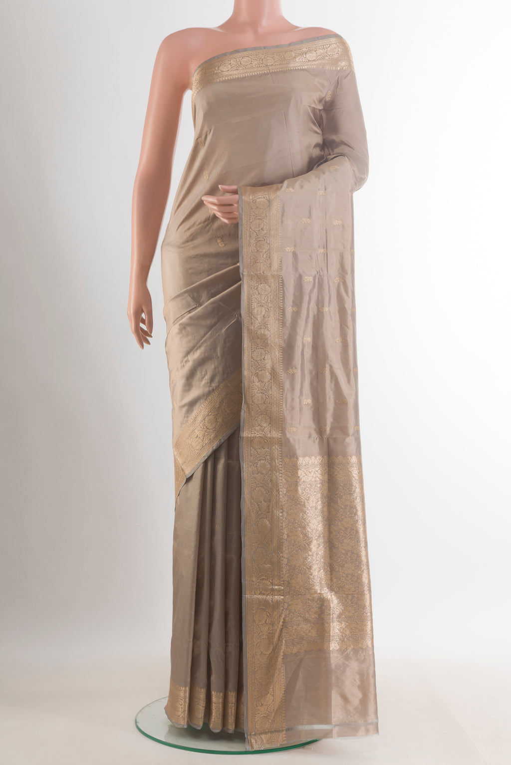 Pure Silk Grey Banarasi Katan Saree with Zari Butta on the body and Zari Border.  displayed on a mannequin