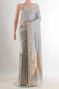 Pure Silk Grey Banarasi Katan Saree with Zari Butta on the body and Zari Border.  displayed on a mannequin