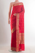 Pure Silk Red Banarasi Katan Saree with Zari Butta on the body and Zari Border.  displayed on a mannequin