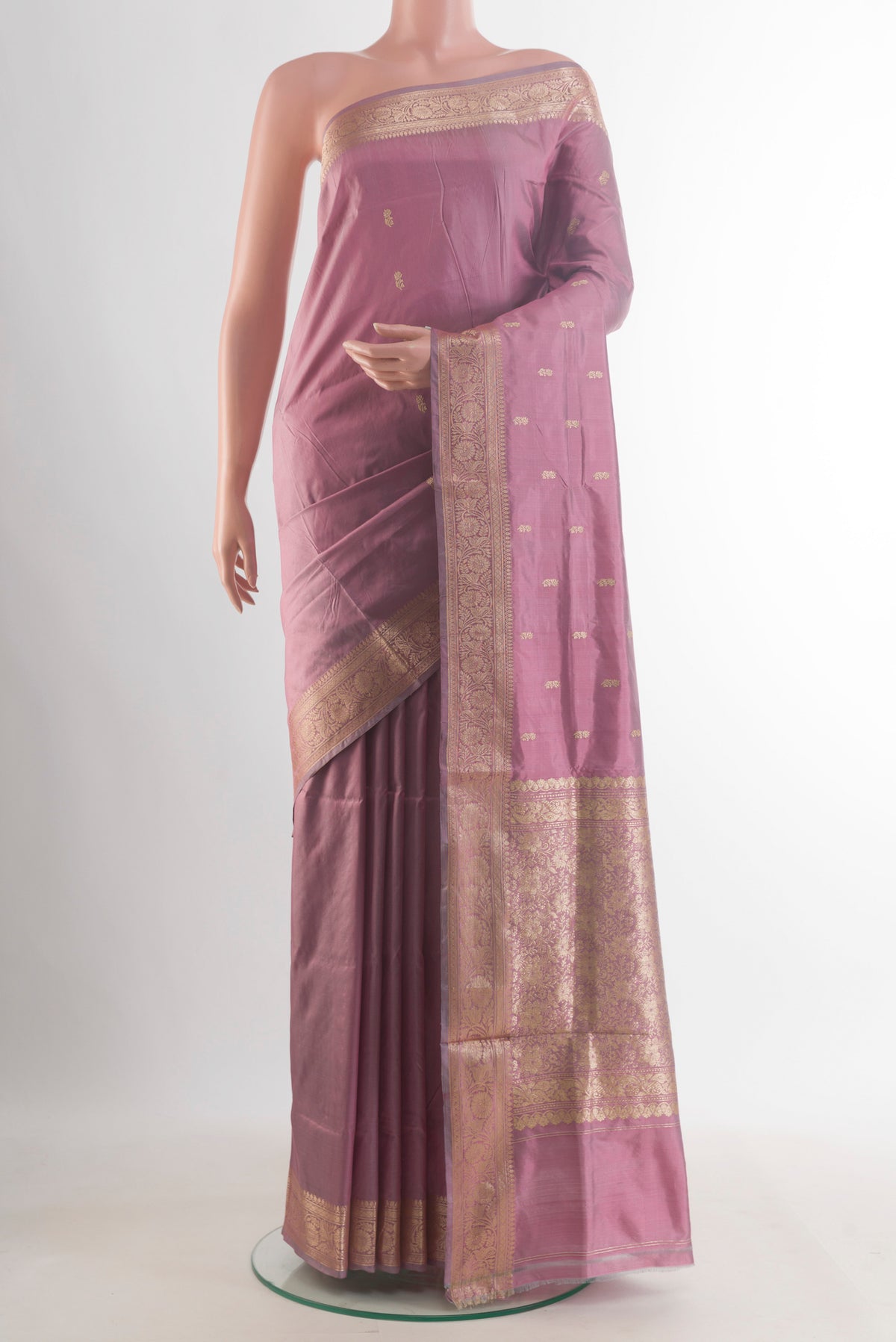 Pure Silk Mauve Banarasi Katan Saree with Zari Butta on the body and Zari Border.  displayed on a mannequin