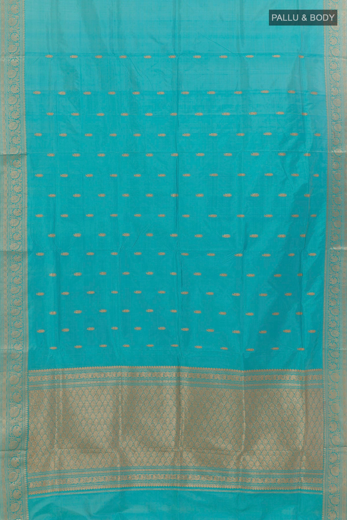 Flat view of Pure Silk Light Blue Banarasi Katan Saree with Zari Butta on the body and Zari Border. 