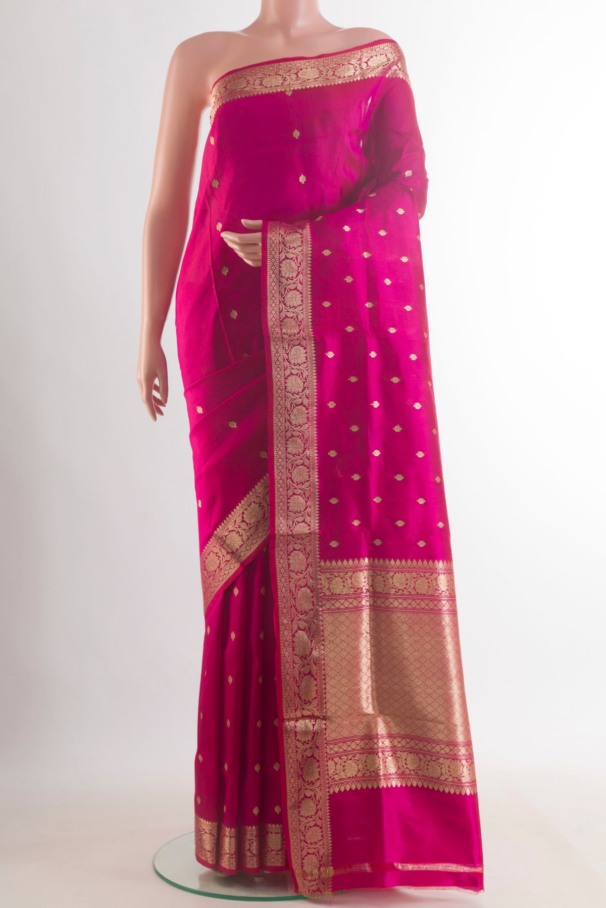 Pure Silk Pink Banarasi Katan Saree with Zari Butta on the body and Zari Border.  displayed on a mannequin